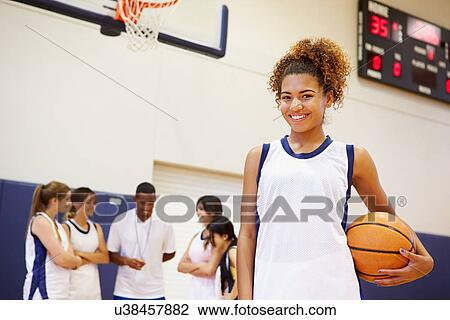 Stock Image - Portrait Of Female High School Basketball Player. Fotosearch