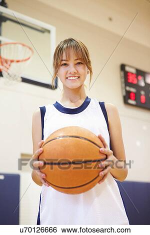 Portrait Of Female High School Basketball Player View Large Photo Image Stock Photograph - Portrait Of Female High School Basketball Player. Fotosearch