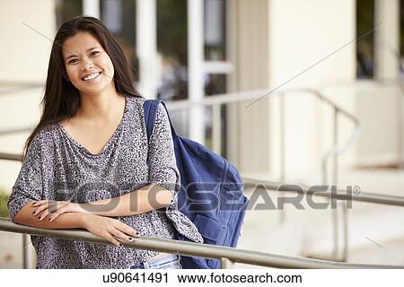Stock Image - Portrait Of Female High School Student Outdoors. Fotosearch