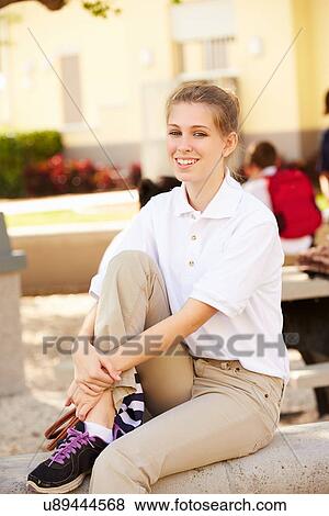 Portrait Of Female High School Student Wearing Uniform View Large Photo Image Stock Photo - Portrait Of Female High School Student Wearing Uniform. Fotosearch