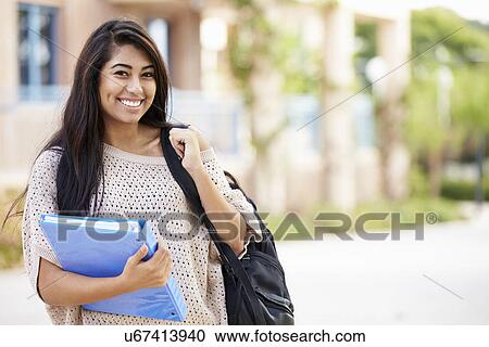 Stock Image - Portrait Of Female University Student Outdoors On Campus. Fotosearch