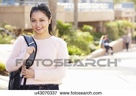 Stock Photo - Portrait Of Female University Student Outdoors On Campus. Fotosearch