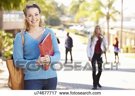 Stock Photo - Portrait Of Female University Student Outdoors On Campus. Fotosearch