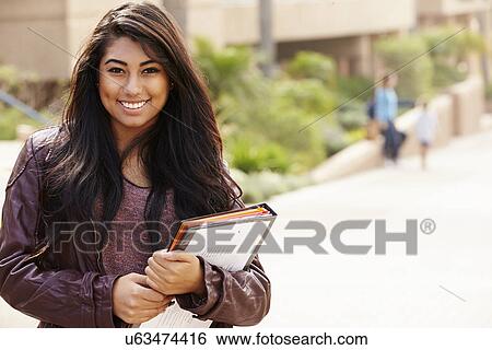Stock Photograph - Portrait Of Female University Student Outdoors On Campus. Fotosearch