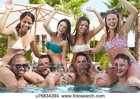 Picture - Portrait Of Friends Having Party In Swimming Pool. Fotosearch