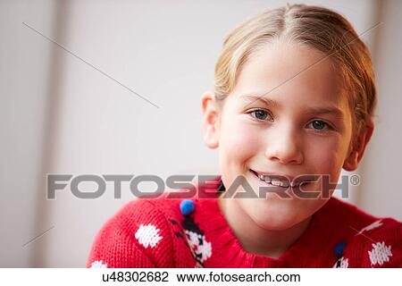 Portrait Of Girl Wearing Christmas Jumper View Large Photo Image Stock Image - Portrait Of Girl Wearing Christmas Jumper. Fotosearch