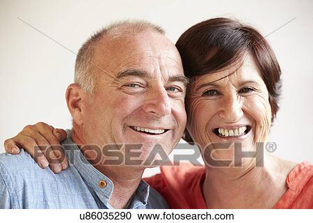 Stock Image - Portrait Of Happy Middle Aged Hispanic Couple. Fotosearch