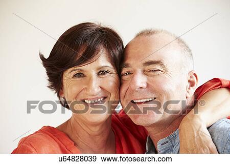 Stock Photo - Portrait Of Happy Middle Aged Hispanic Couple. Fotosearch