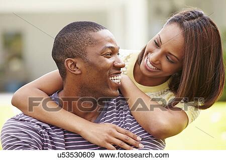 Portrait Of Happy Young Couple In Garden View Large Photo Image Stock Photo - Portrait Of Happy Young Couple In Garden. Fotosearch