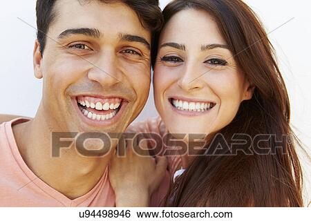 Stock Photograph - Portrait Of Happy Young Hispanic Couple. Fotosearch