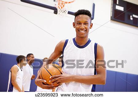 Stock Image - Portrait Of High School Basketball Player. Fotosearch