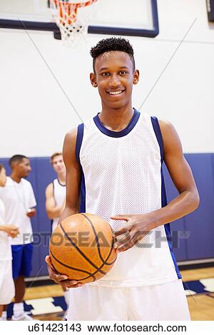 Stock Image - Portrait Of High School Basketball Player. Fotosearch