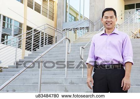Portrait Of High School Teacher Standing Outside Building View Large Photo Image Stock Image - Portrait Of High School Teacher Standing Outside Building. Fotosearch