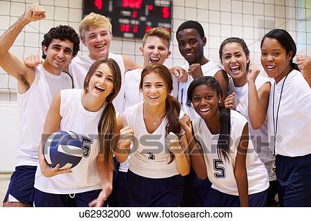 Stock Image - Portrait Of High School Volleyball Team Members With Coach. Fotosearch