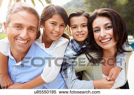 Stock Photography - Portrait Of Hispanic Family In Countryside. Fotosearch