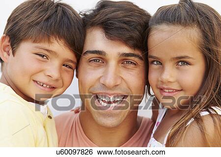 Stock Photograph - Portrait Of Hispanic Father With Children. Fotosearch