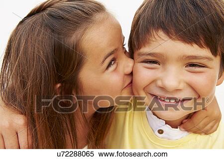 Portrait Of Hispanic Girl Kissing Boy View Large Photo Image Stock Photography - Portrait Of Hispanic Girl Kissing Boy. Fotosearch