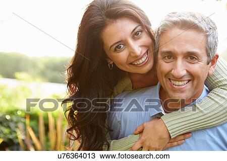 Portrait Of Loving Hispanic Couple In Countryside View Large Photo Image Stock Image - Portrait Of Loving Hispanic Couple In Countryside. Fotosearch