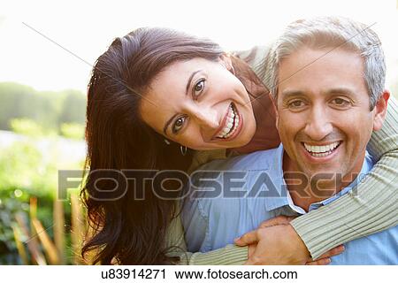 Portrait Of Loving Hispanic Couple In Countryside View Large Photo Image Stock Image - Portrait Of Loving Hispanic Couple In Countryside. Fotosearch