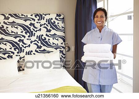 Portrait Of Maid Tidying Hotel Room View Large Photo Image Stock Image - Portrait Of Maid Tidying Hotel Room. Fotosearch