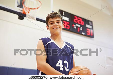 Stock Image - Portrait Of Male High School Basketball Player. Fotosearch