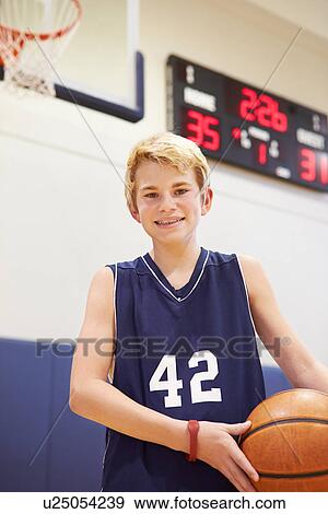 Stock Photo - Portrait Of Male High School Basketball Player. Fotosearch