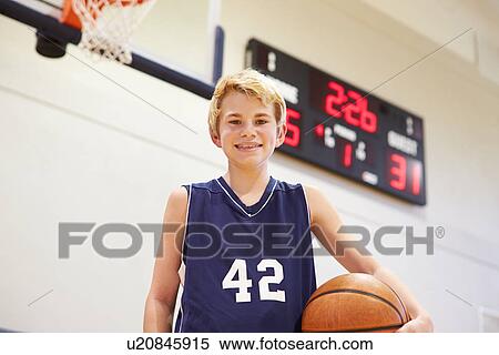 Stock Photography - Portrait Of Male High School Basketball Player. Fotosearch