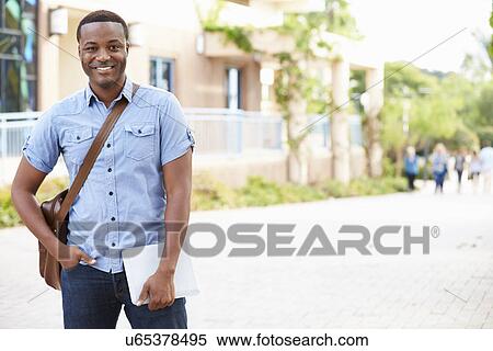 Stock Photography - Portrait Of Male University Student Outdoors On Campus. Fotosearch