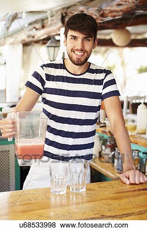 Portrait Of Man In Restaurant Making Fruit Smoothies View Large Photo Image Stock Photo - Portrait Of Man In Restaurant Making Fruit Smoothies. Fotosearch
