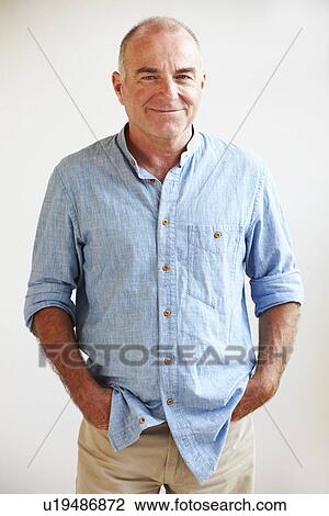 Portrait Of Middle Aged Man Standing By Wall View Large Photo Image Stock Image - Portrait Of Middle Aged Man Standing By Wall. Fotosearch