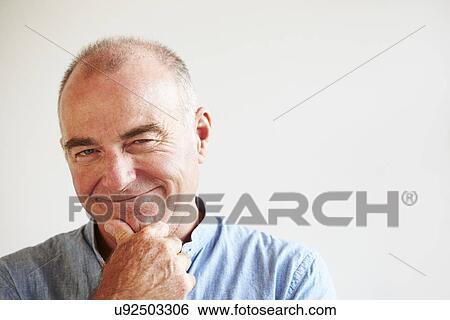 Portrait Of Middle Aged Man Standing By Wall View Large Photo Image Stock Photograph - Portrait Of Middle Aged Man Standing By Wall. Fotosearch