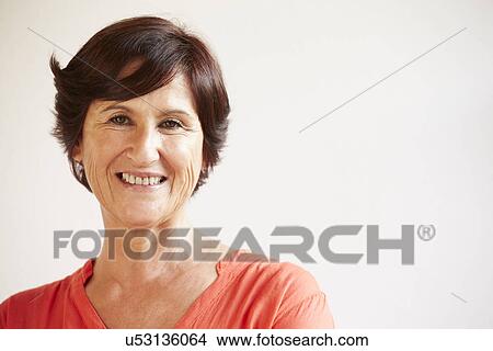 Portrait Of Middle Aged Woman Standing By Wall View Large Photo Image Picture - Portrait Of Middle Aged Woman Standing By Wall. Fotosearch