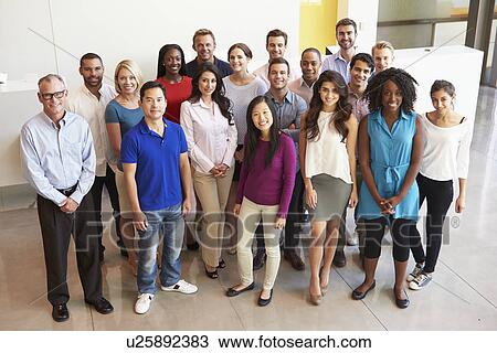 Stock Image - Portrait Of Multi-Cultural Office Staff Standing In Lobby. Fotosearch