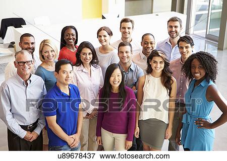 Stock Photo - Portrait Of Multi-Cultural Office Staff Standing In Lobby. Fotosearch