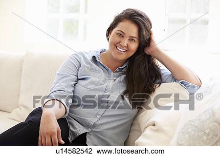 Portrait Of Overweight Woman Sitting On Sofa View Large Photo Image Stock Image - Portrait Of Overweight Woman Sitting On Sofa. Fotosearch