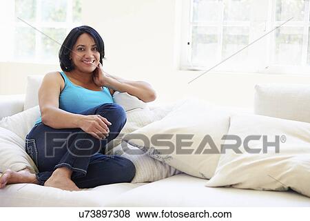 Portrait Of Overweight Woman Sitting On Sofa View Large Photo Image Stock Photo - Portrait Of Overweight Woman Sitting On Sofa. Fotosearch