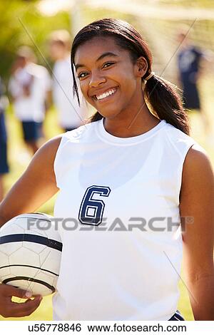 Stock Photograph - Portrait Of Player In Female High School Soccer Team. Fotosearch