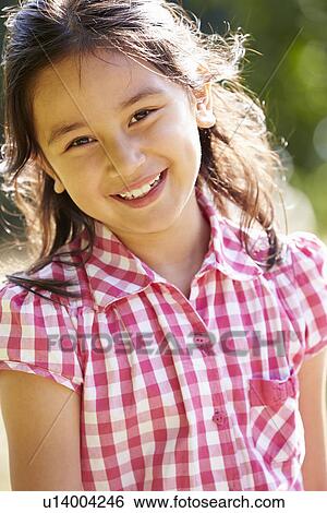 Stock Photograph - Portrait Of Pretty Asian Girl In Countryside. Fotosearch
