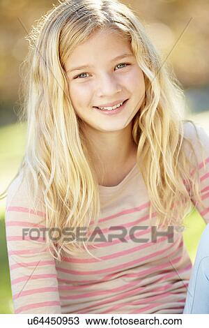 Stock Image - Portrait Of Pretty Girl In Countryside. Fotosearch