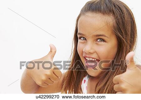 Stock Image - Portrait Of Pretty Hispanic Girl Making Thumbs Up Gesture. Fotosearch