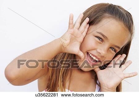 Stock Image - Portrait Of Pretty Hispanic Girl Shouting At Camera. Fotosearch