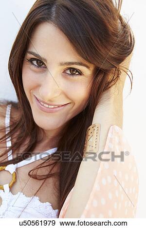 Portrait Of Pretty Young Woman Standing By Wall View Large Photo Image Stock Photo - Portrait Of Pretty Young Woman Standing By Wall. Fotosearch