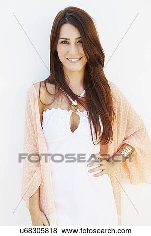 Portrait Of Pretty Young Woman Standing By Wall View Large Photo Image Stock Photo - Portrait Of Pretty Young Woman Standing By Wall. Fotosearch