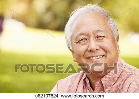 Portrait Of Smiling Senior Asian Man Sitting In Park View Large Photo Image Picture - Portrait Of Smiling Senior Asian Man Sitting In Park . Fotosearch
