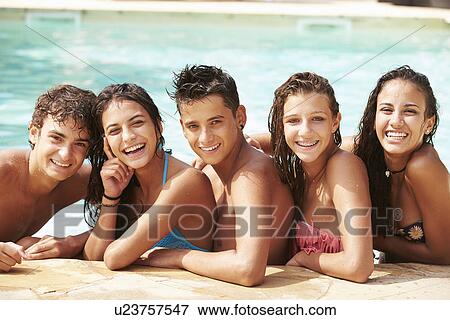 Portrait Of Teenage Friends Having Fun In Swimming Pool View Large Photo Image Stock Photo - Portrait Of Teenage Friends Having Fun In Swimming Pool. Fotosearch
