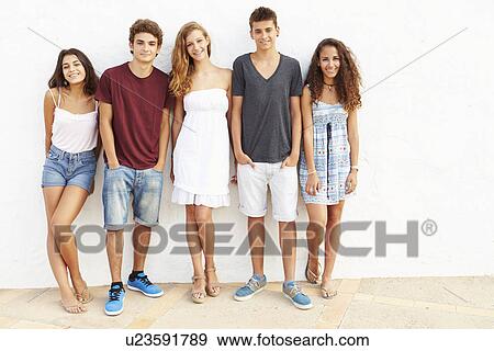Portrait Of Teenage Group Leaning Against Wall View Large Photo Image Stock Photo - Portrait Of Teenage Group Leaning Against Wall. Fotosearch