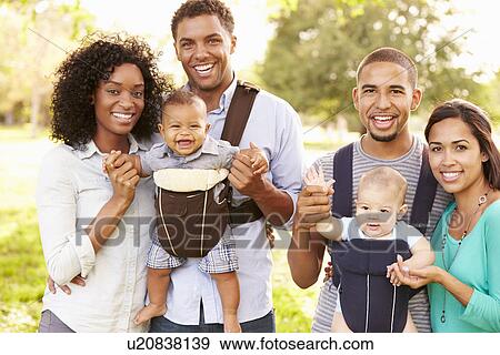 Portrait Of Two Families With Baby Carriers In Park View Large Photo Image Stock Photo - Portrait Of Two Families With Baby Carriers In Park. Fotosearch