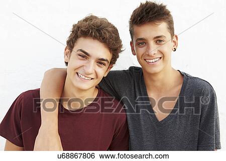 Portrait Of Two Hispanic Teenage Boys Leaning Against Wall View Large Photo Image Stock Photograph - Portrait Of Two Hispanic Teenage Boys Leaning Against Wall. Fotosearch