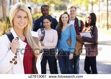 Stock Image - Portrait Of University Students Outdoors On Campus. Fotosearch