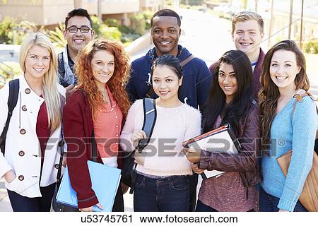 Stock Image - Portrait Of University Students Outdoors On Campus. Fotosearch